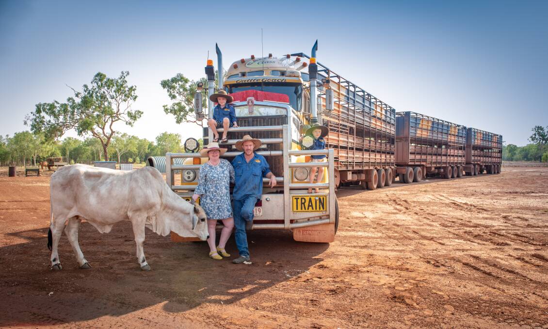Mandy with husband Matches, sons Flynn (top) and Liam (right), their rescued cow Daisy and the now-famous road train (Photo - Katherine Morrow).