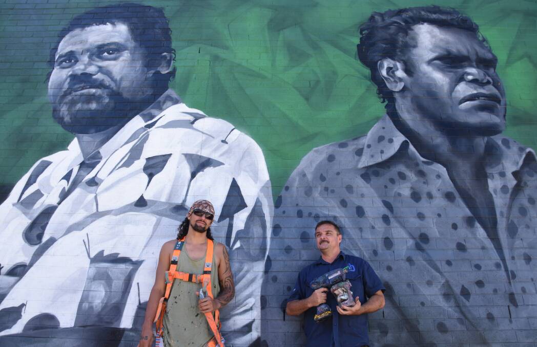 Artists Jesse Bell (left) and David Collins (right) with the finished mural.