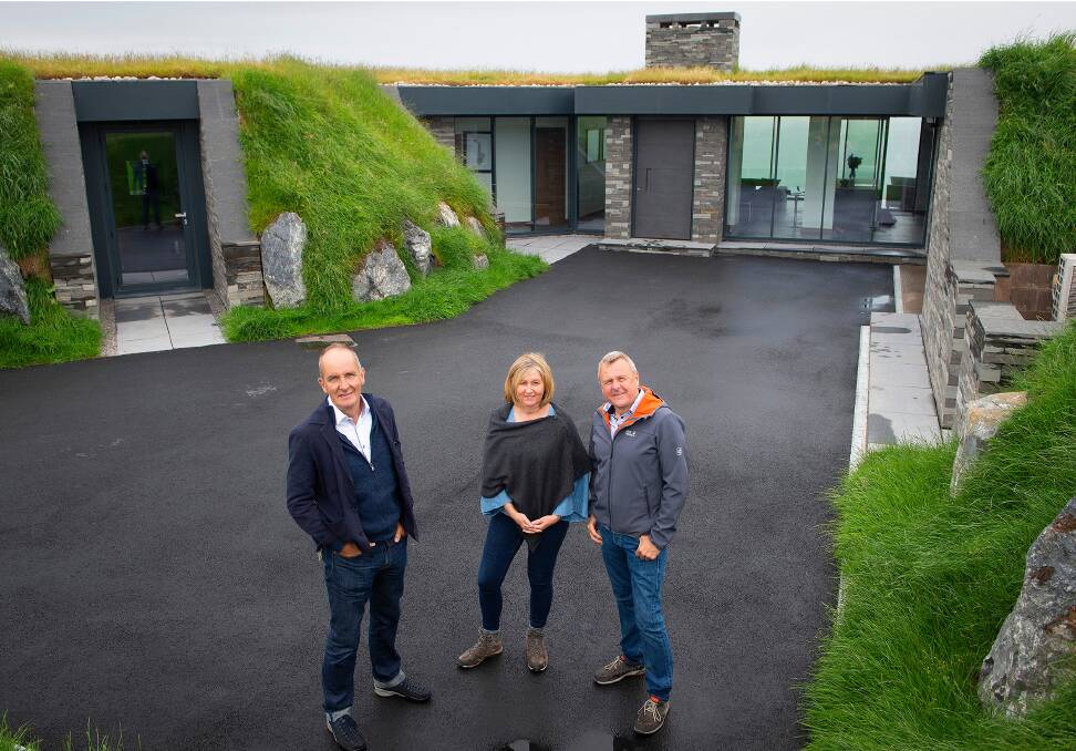 Grand Designs host Kevin McCloud with Andy Stakes and Jeanette Hardy who turned an old military listening station on a wind-swept Scottish cliff edge into a glass-fronted dream home. 