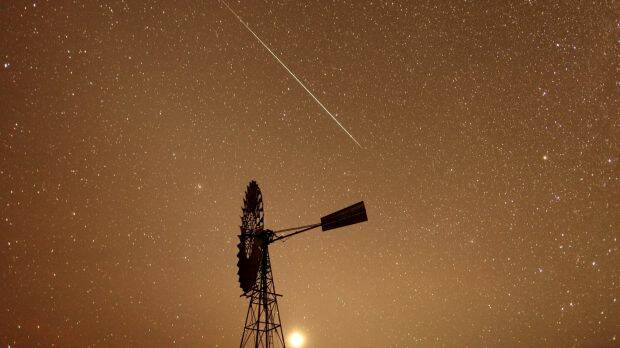 A meteor burns up in the atmosphere over the Spell Bore Yards on Newcastle Waters Station in the NT's Barkly region Photo: Glenn Campbell