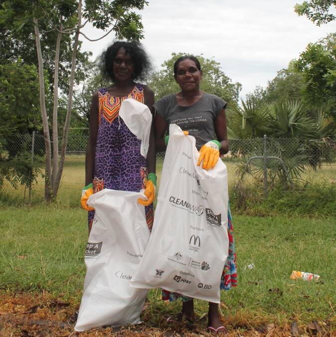 Karen Ngalmi and Josie Maminyamanja donned gloves and picked up rubbish bags to help clean up Katherine last year. 