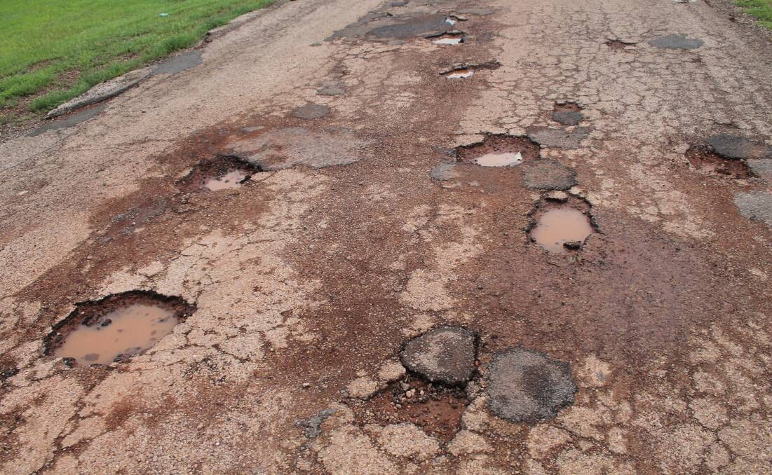 BUMPY RIDE: It is a bumpy ride into Kalano community with dozens of potholes on the road.