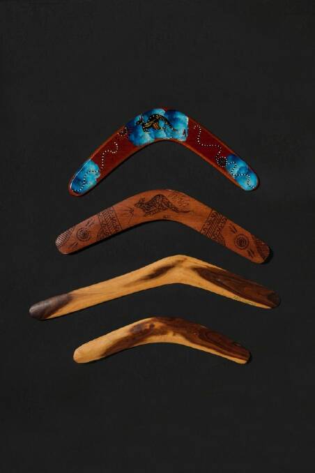 The top two boomerangs of are the fake type commonly sold in souvenir stores around Australia. The bottom two are genuine boomerangs, by Rolley Mintuma at Maruku Arts, NT. Photo: Jennifer Soo